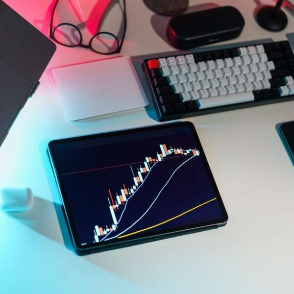 Financial analytics displayed across devices on a modern research desk