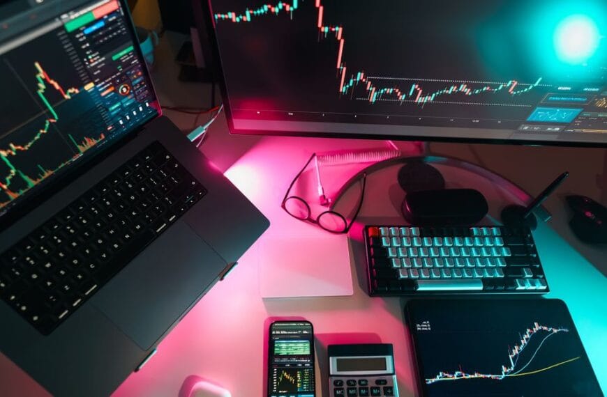 Modern trading workstation with multiple market charts on digital screens