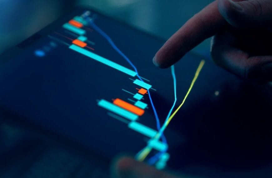 Finger inspecting financial data on a tablet chart