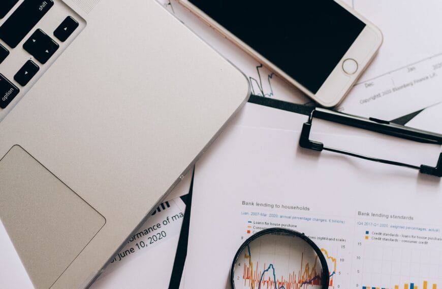 Financial records, smartphone and magnifying glass used to examine what portfolio trackers know and miss
