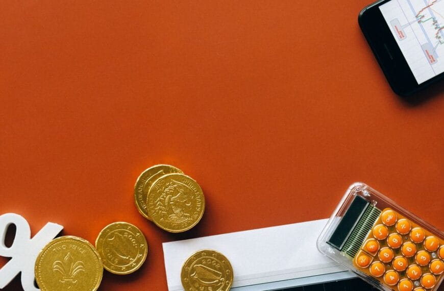 Coins, calculator and financial charts used for opportunity-cost analysis