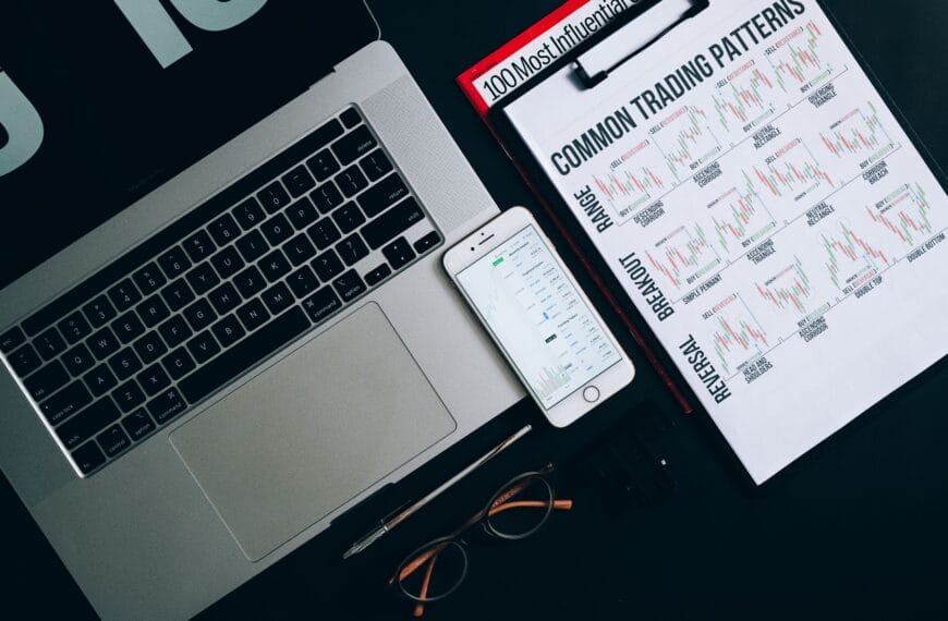 Laptop, smartphone and printed financial records representing wallet addresses, exchange APIs and CSV evidence sources